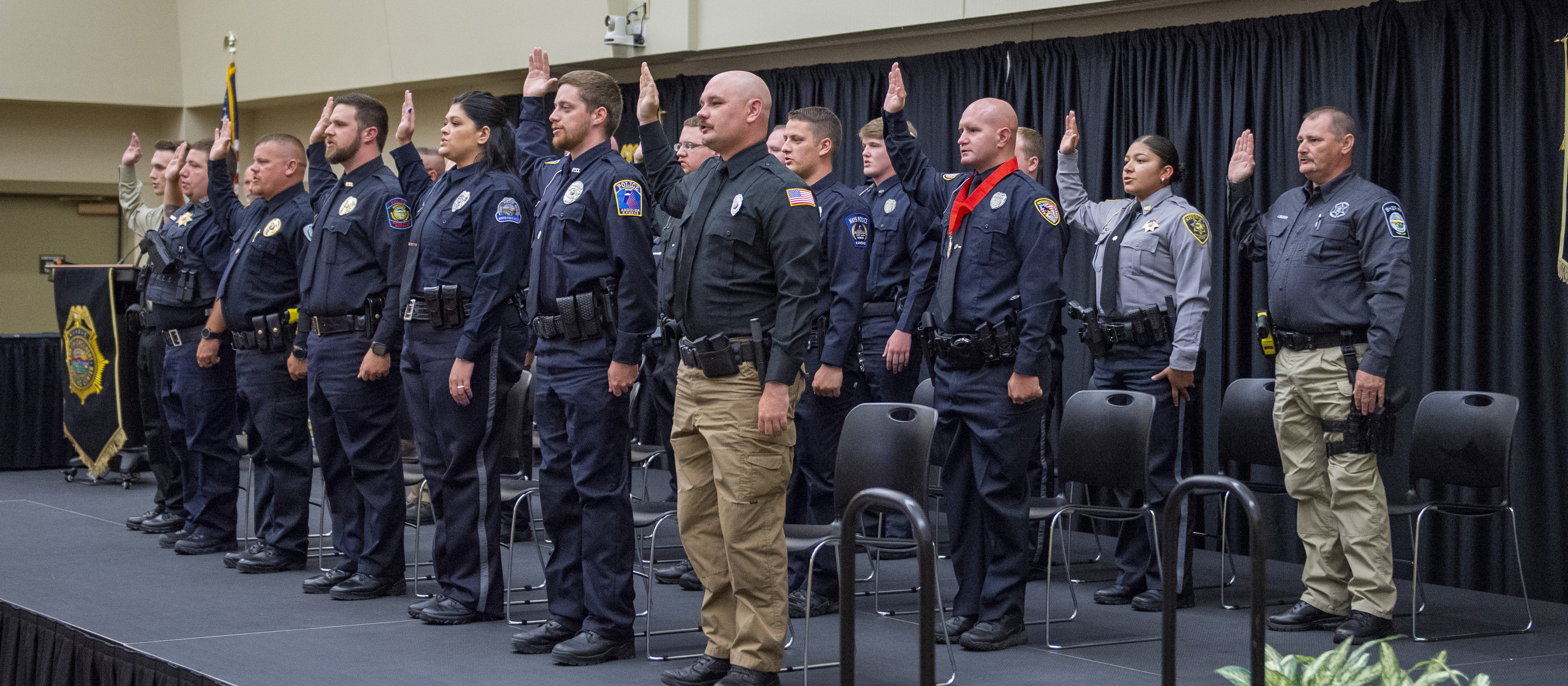 The 297th basic training class recites the oath of office.