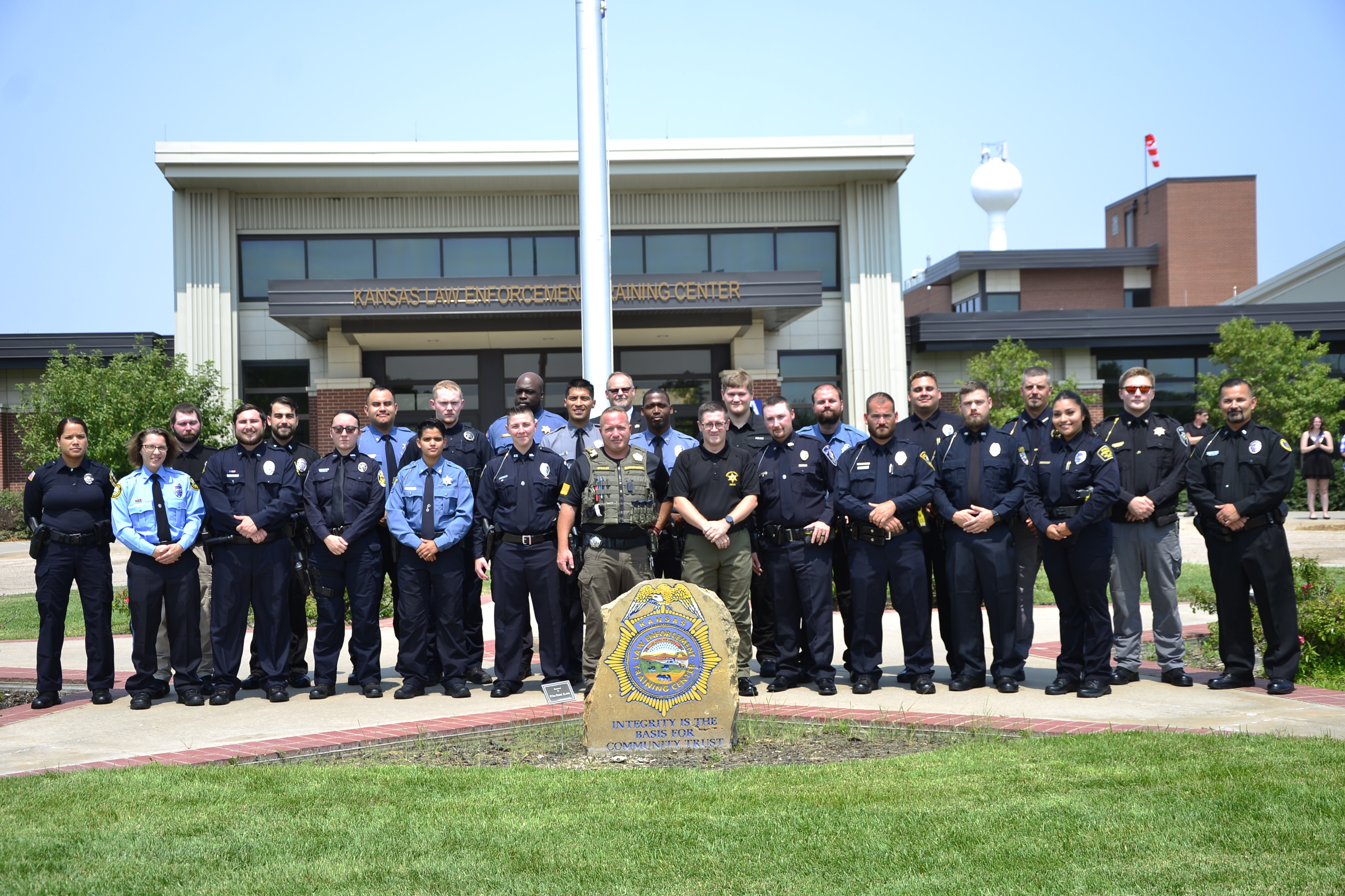 328 class in front of flag pole