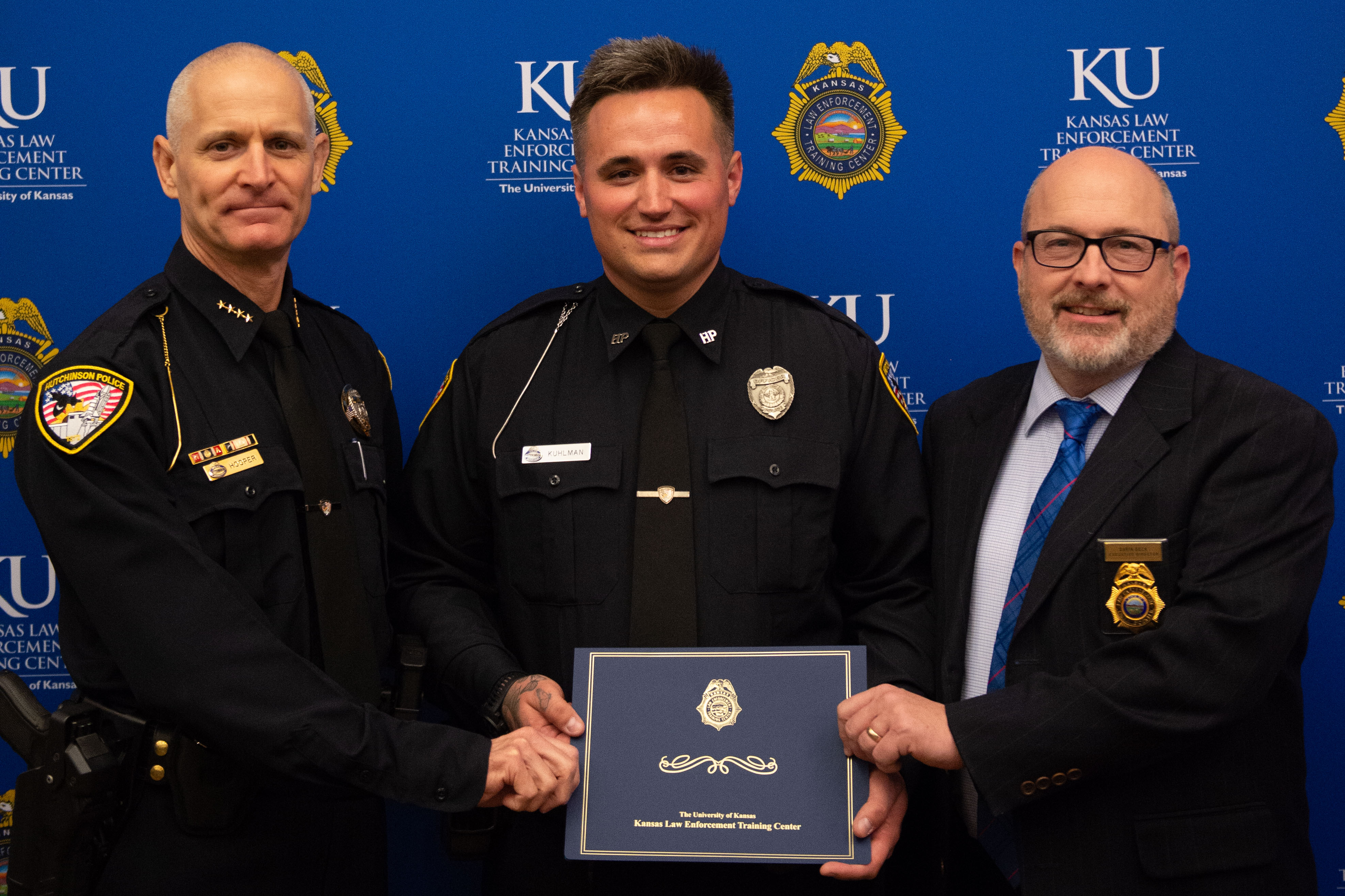 Chief Jeffrey Hooper, Class President Kody Kuhlman and Executive Director Darin Beck