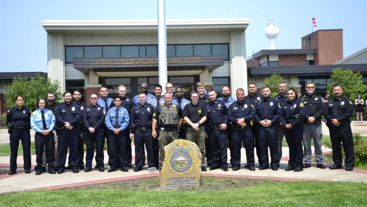 328 class in front of flag pole